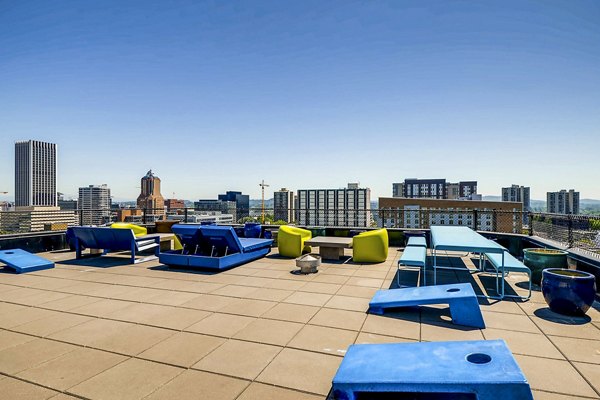 Cozy outdoor patio with seating and plants at Park Plaza Apartments, luxury living