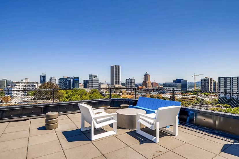 Cozy balcony with city views at Park Plaza Apartments, ideal for outdoor relaxation and leisure in a tranquil urban setting