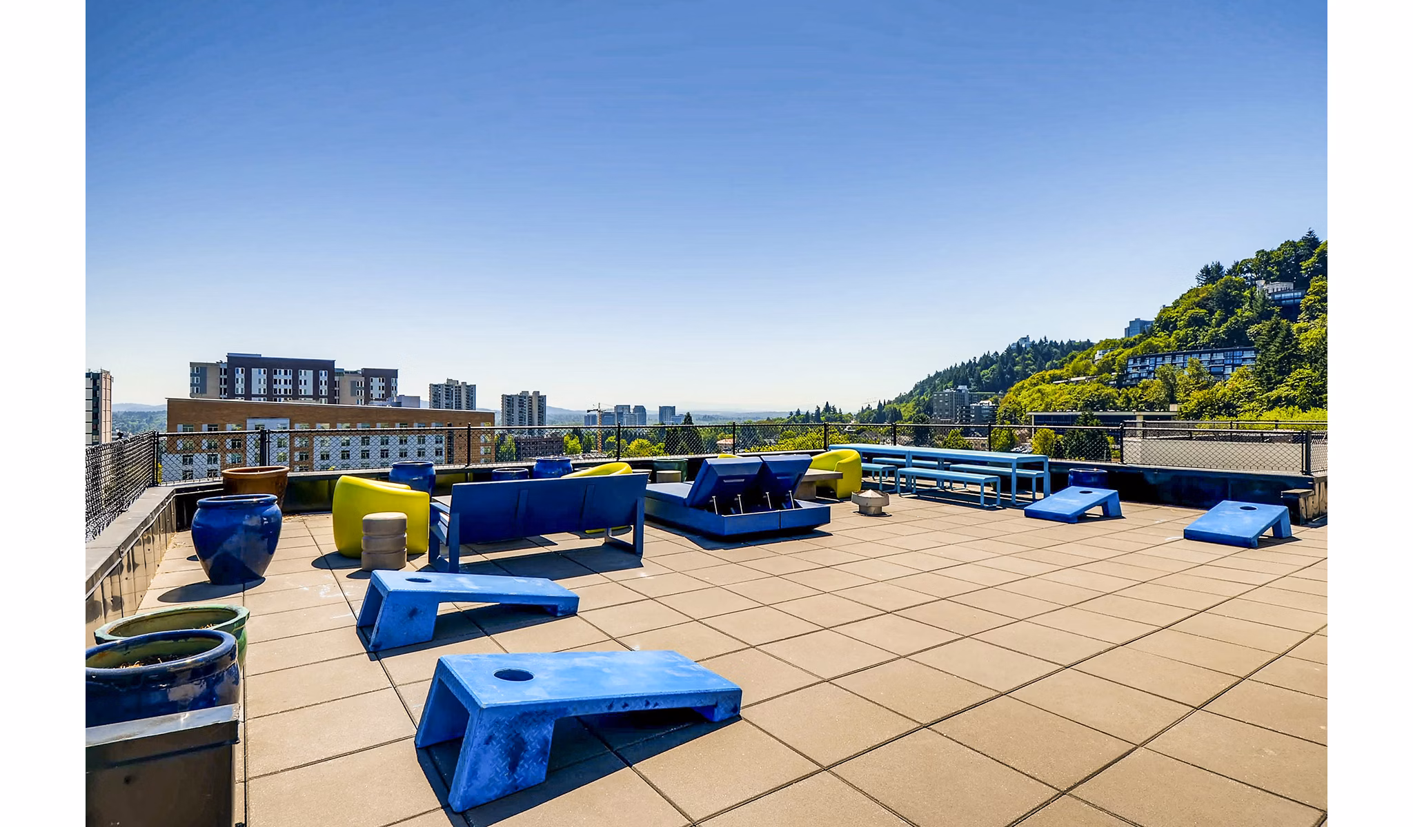 Modern patio with outdoor seating and city views at Park Plaza Apartments