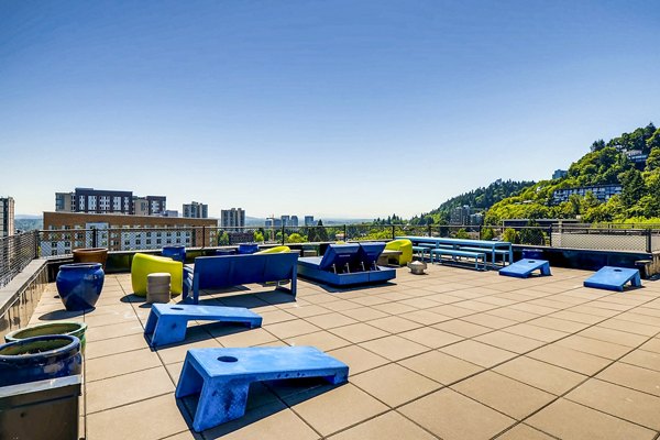 Modern patio with outdoor seating and city views at Park Plaza Apartments