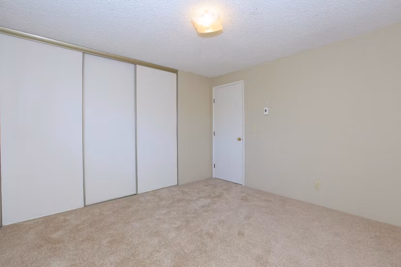 Cozy bedroom with stylish decor at Redwood Park Apartments, a Greystar luxury community, offering modern amenities and comfortable living spaces