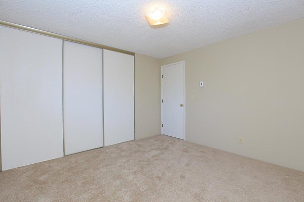Cozy bedroom with stylish decor at Redwood Park Apartments, a Greystar luxury community, offering modern amenities and comfortable living spaces