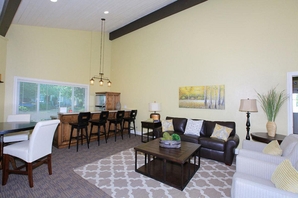 Clubhouse with modern design and spacious seating areas at Redwood Park Apartments