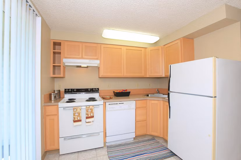 Spacious kitchen with modern appliances in Redwood Park Apartments Perfect for culinary enthusiasts seeking luxury living