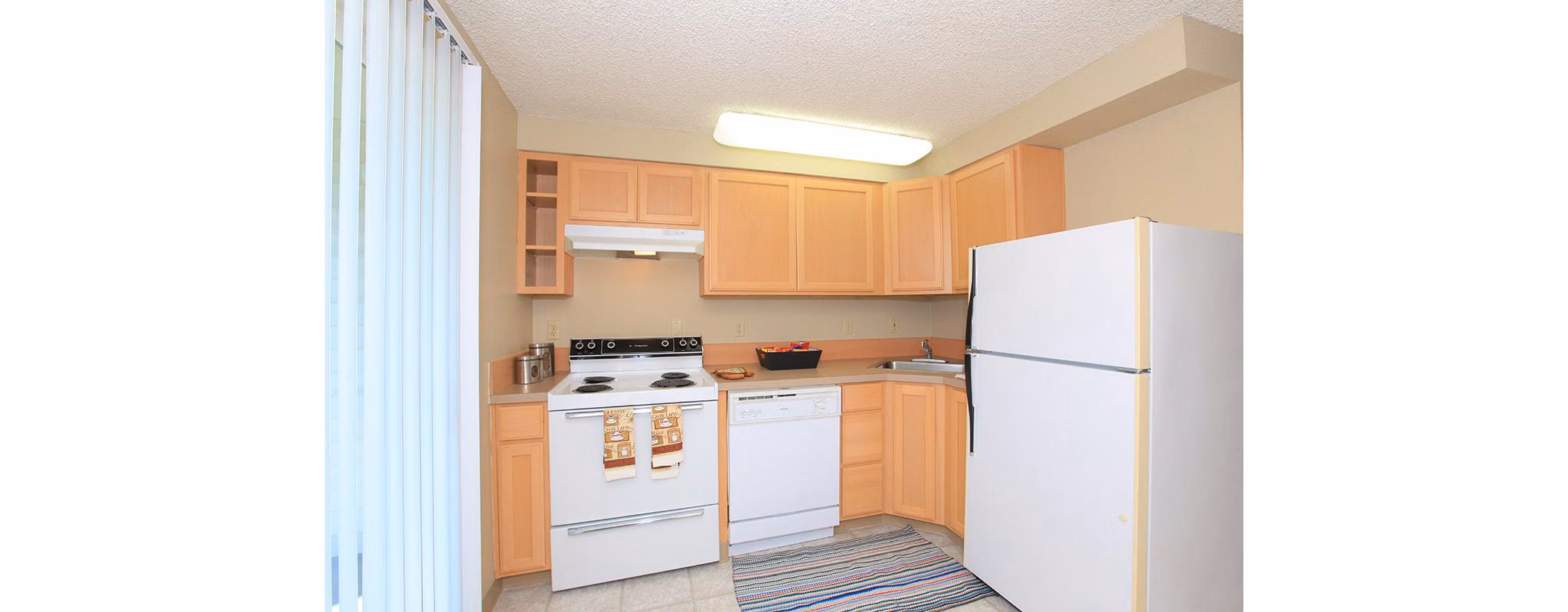 Spacious kitchen with modern appliances in Redwood Park Apartments Perfect for culinary enthusiasts seeking luxury living