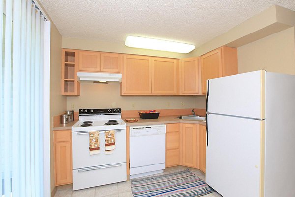 Spacious kitchen with modern appliances in Redwood Park Apartments Perfect for culinary enthusiasts seeking luxury living