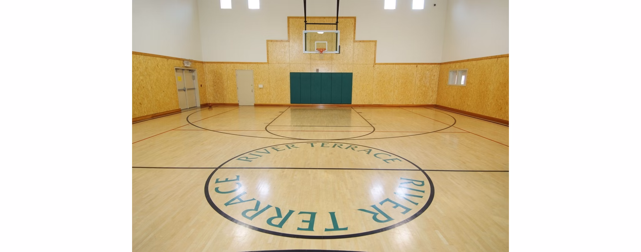 Outdoor basketball court with modern facilities at River Terrace Apartments