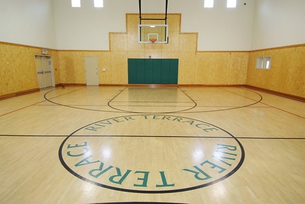 Outdoor basketball court with modern facilities at River Terrace Apartments