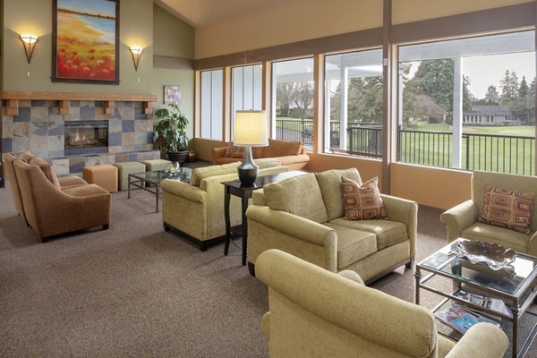 Clubhouse featuring modern design and communal seating in Summerfield Apartments