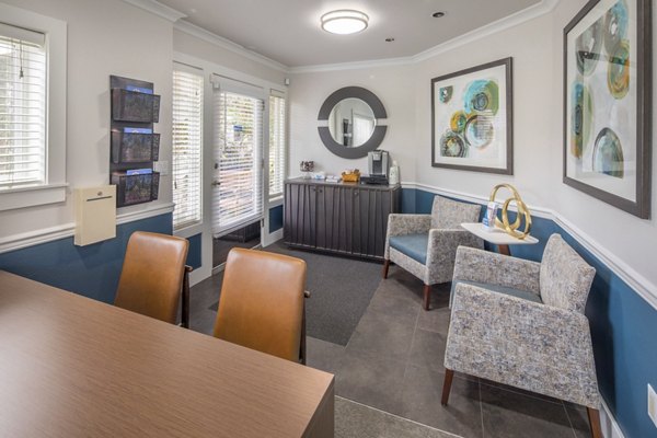 Clubhouse with modern furnishings and large windows at Summerfield Apartments, a luxury Greystar community