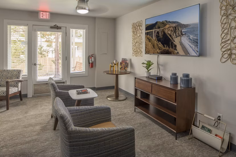 Clubhouse with modern design and ample seating at Summerfield Apartments, by Greystar