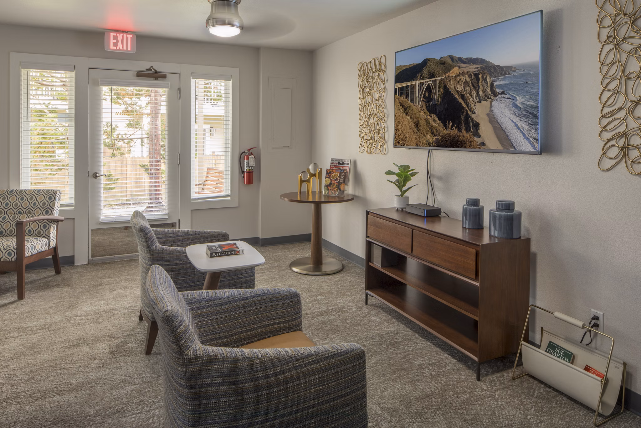 Clubhouse with modern design and ample seating at Summerfield Apartments, by Greystar