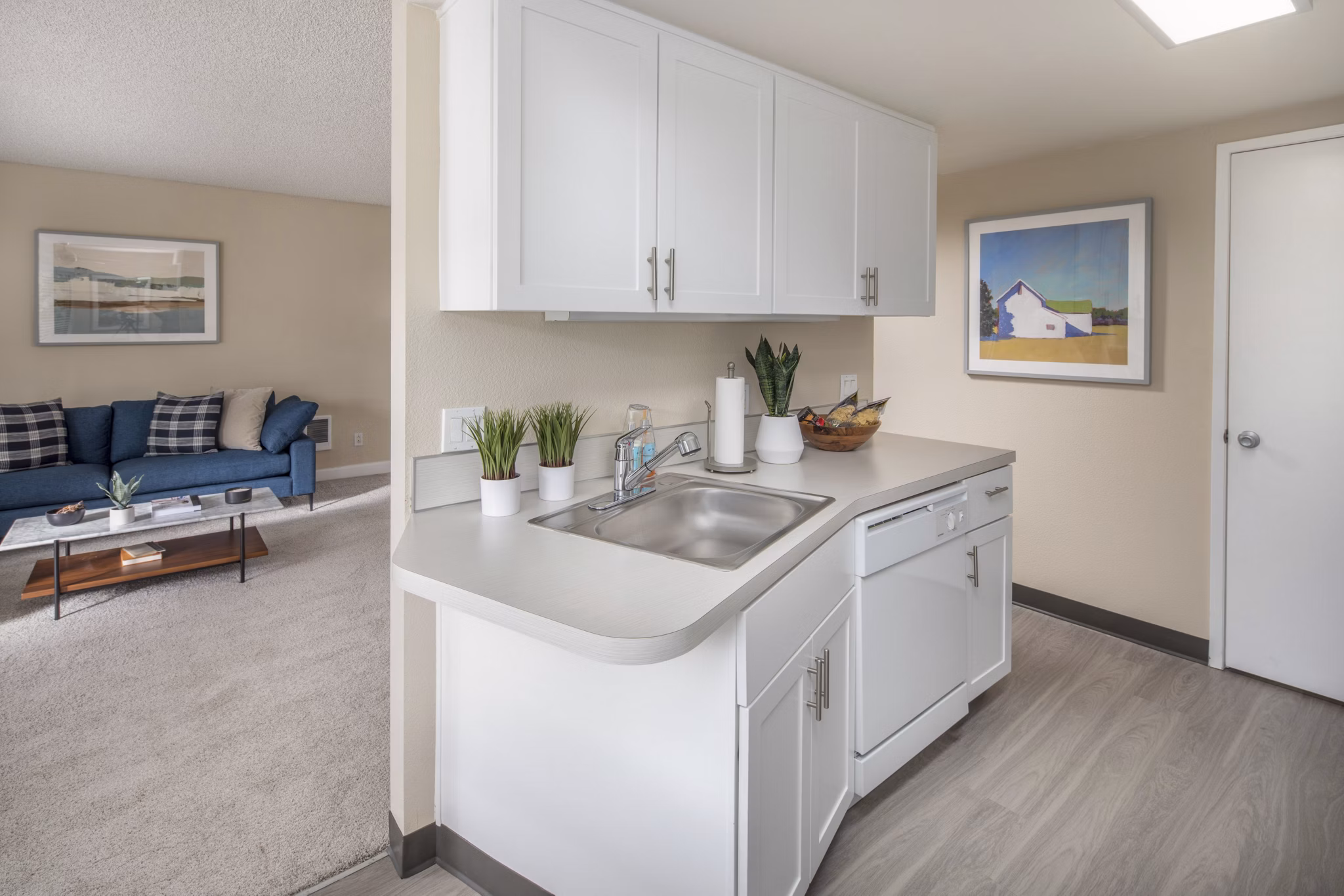 Modern kitchen with stainless steel appliances and granite countertops at Summerfield Apartments