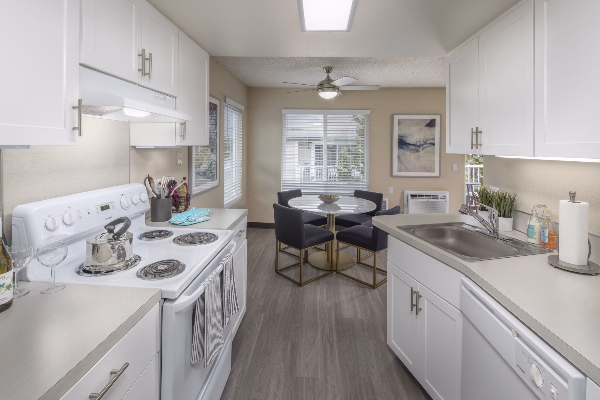 Kitchen featuring modern appliances and sleek cabinetry at Summerfield Apartments