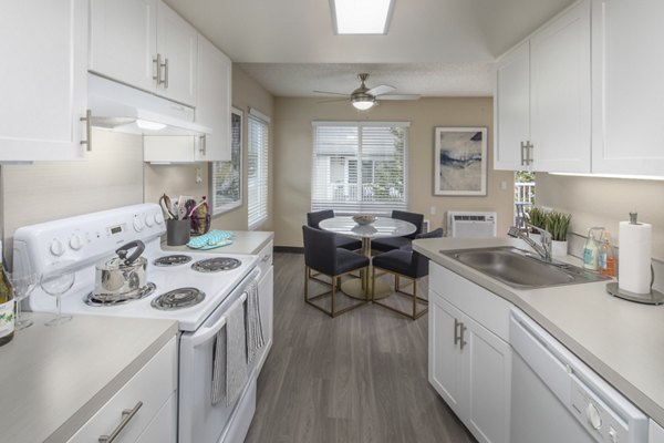Kitchen featuring modern appliances and sleek cabinetry at Summerfield Apartments