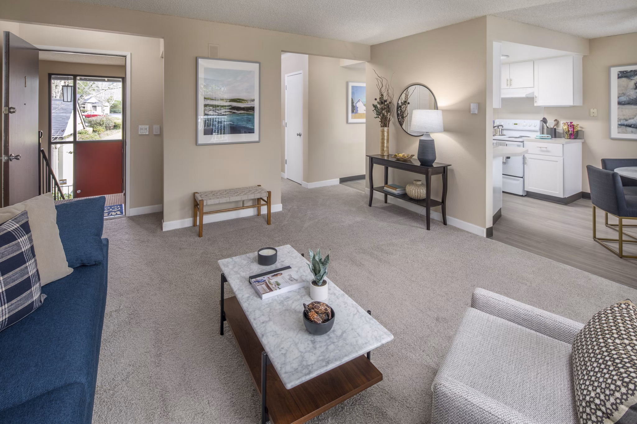 Living room with chic furniture and natural light at Summerfield Apartments