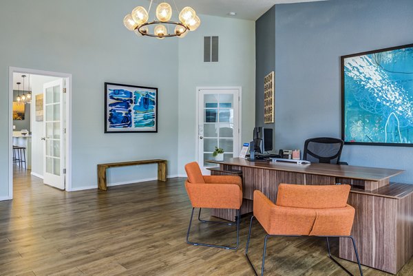 Clubhouse and leasing office at Village at Cascade Park Apartments with modern design elements and comfortable seating areas