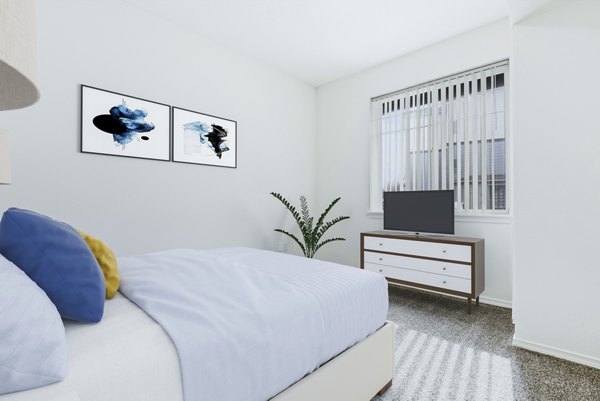 Cozy bedroom with modern furnishings at Logger Creek at Parkcenter Apartments