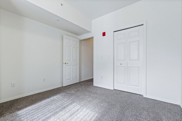 Cozy bedroom with modern decor at Logger Creek at Parkcenter Apartments