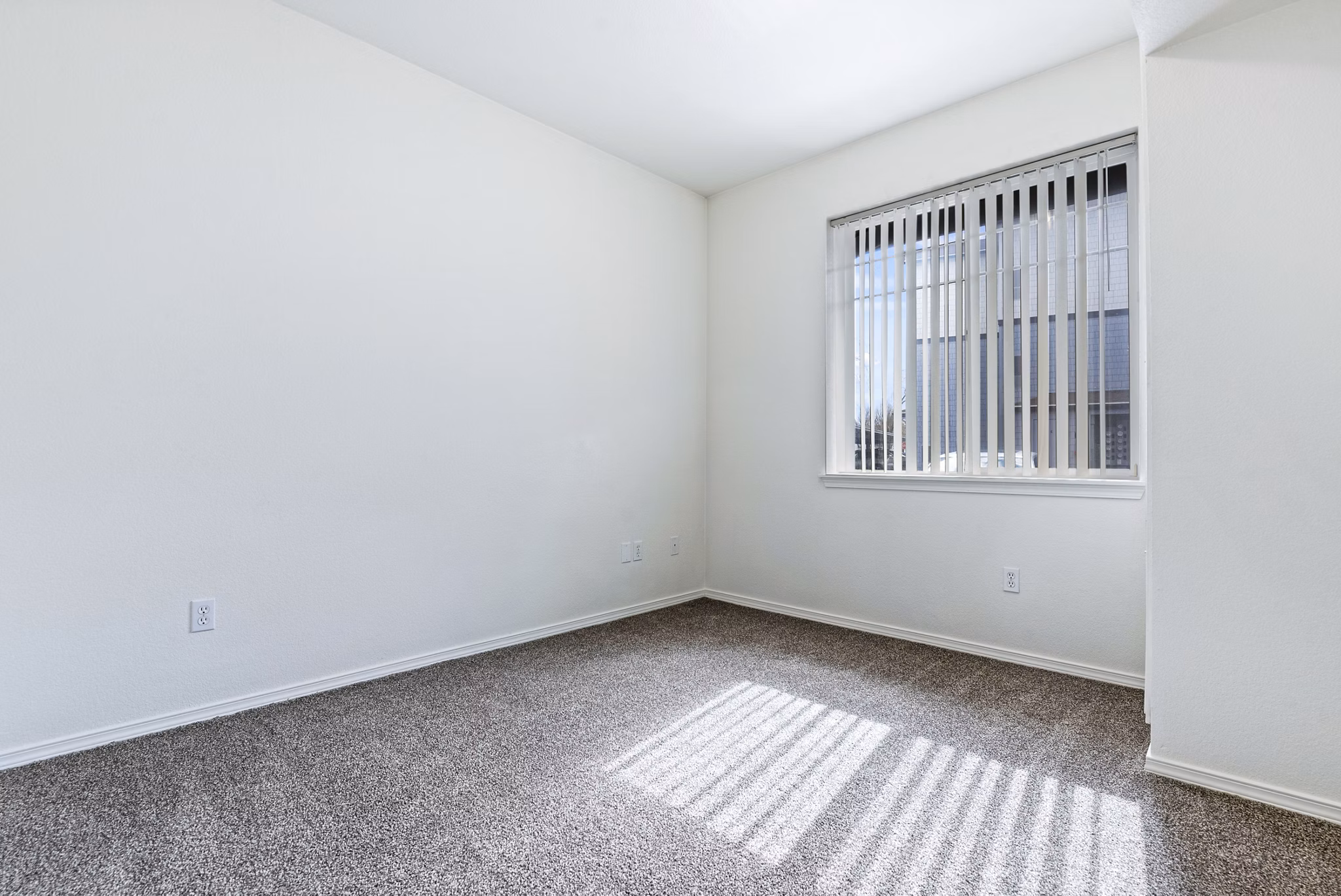 Bedroom with contemporary design elements at Logger Creek at Parkcenter Apartments