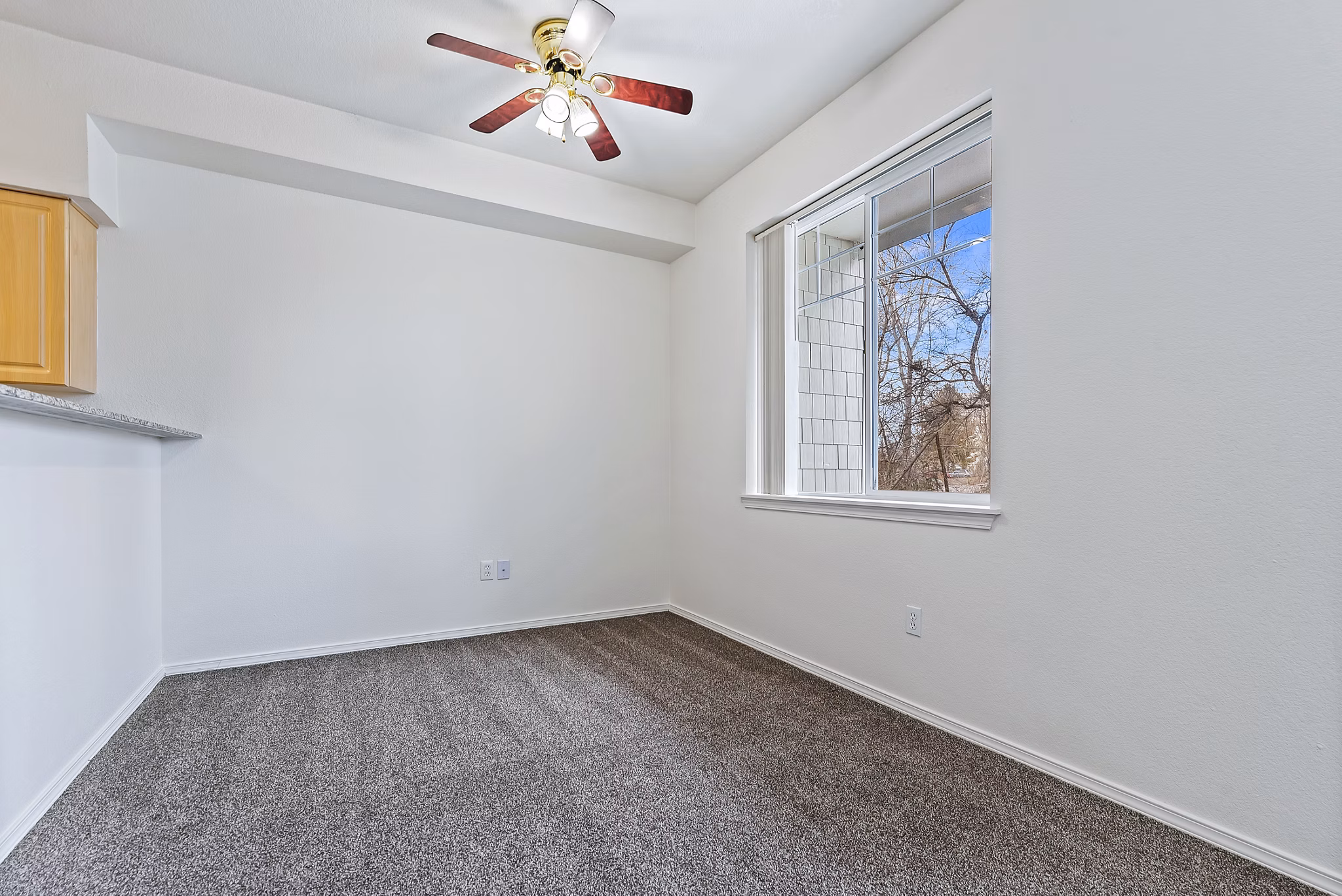 Dining area featuring elegant lighting and modern decor in Logger Creek at Parkcenter Apartments