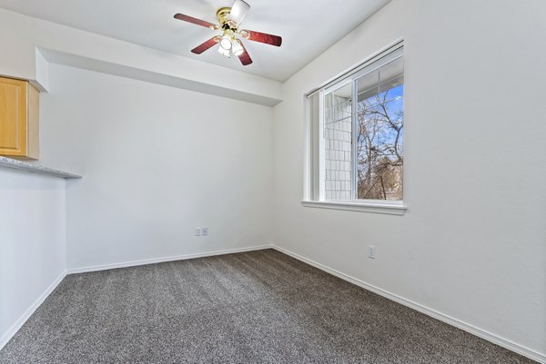 Dining area featuring elegant lighting and modern decor in Logger Creek at Parkcenter Apartments