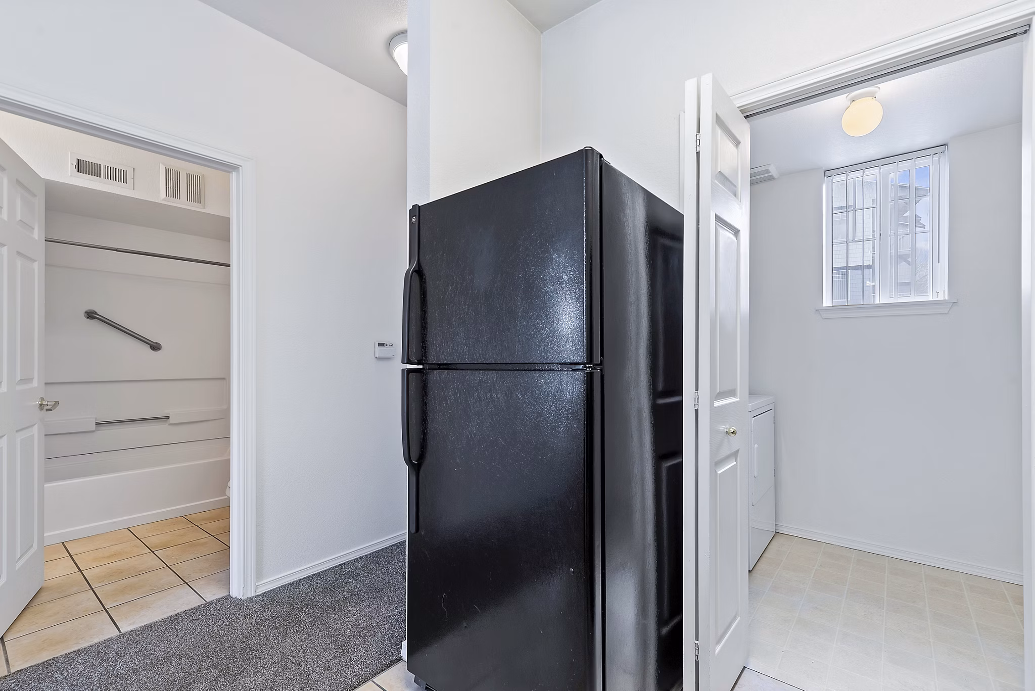 Modern kitchen with stainless steel appliances at Logger Creek at Parkcenter Apartments