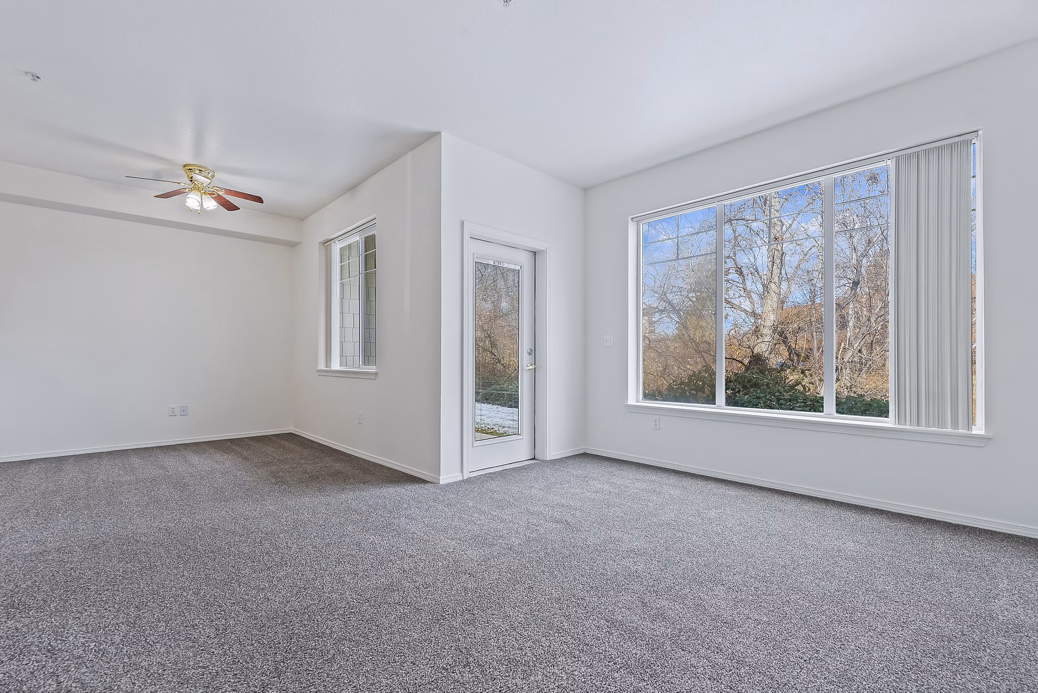 Spacious living room with modern decor in Logger Creek at Parkcenter Apartments