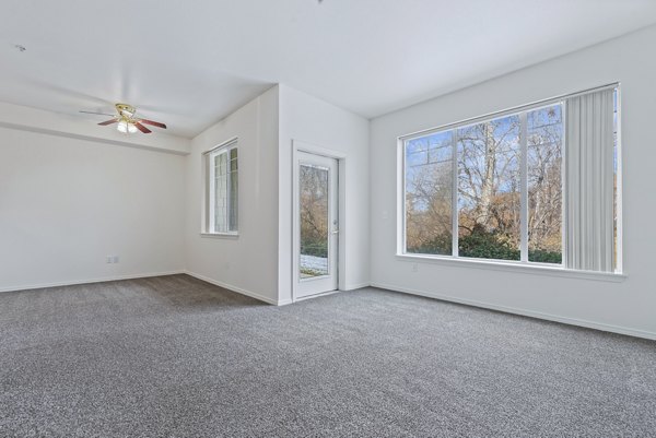 Spacious living room with modern decor in Logger Creek at Parkcenter Apartments