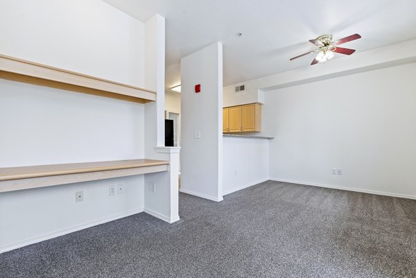 Modern home office with sleek furniture in Logger Creek at Parkcenter Apartments living room