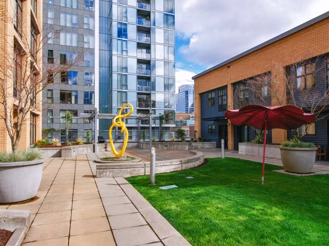 Clubhouse featuring modern lounge and conference area at Museum Place Apartments, a luxury community by Greystar