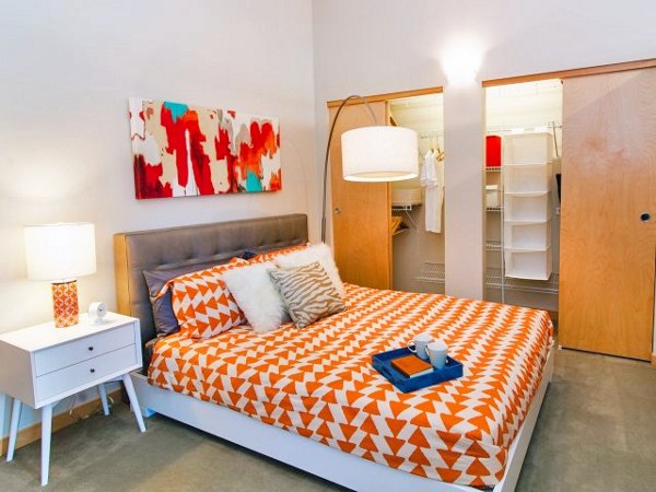 Cozy bedroom with modern decor at Museum Place Apartments, a Greystar luxury property in the heart of the city
