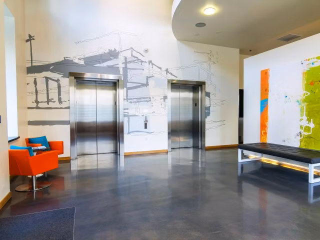 Museum Place Apartments: Modern clubhouse featuring elegant design and communal seating areas