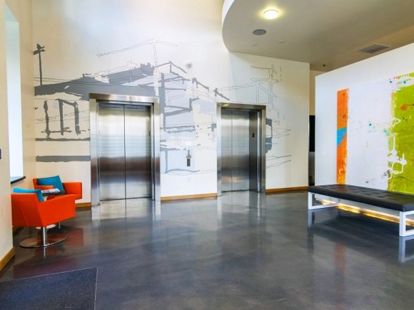 Museum Place Apartments: Modern clubhouse featuring elegant design and communal seating areas