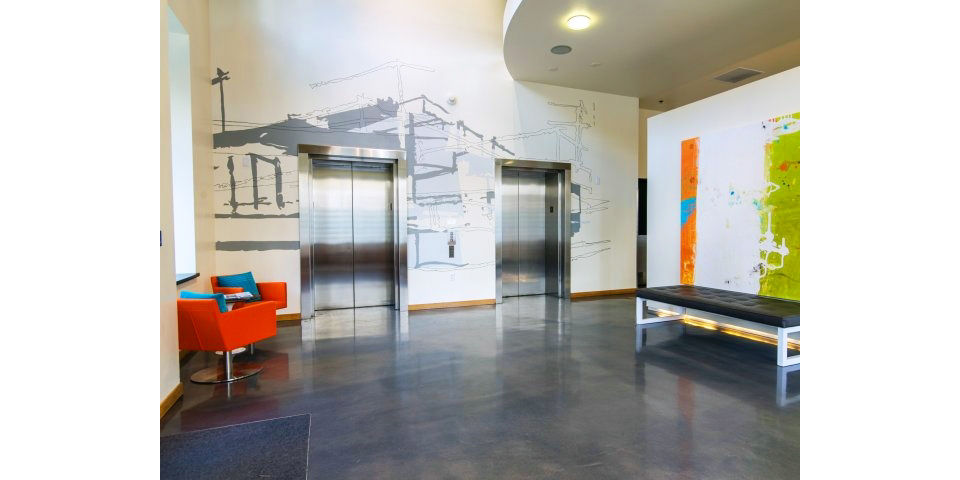 Museum Place Apartments: Modern clubhouse featuring elegant design and communal seating areas