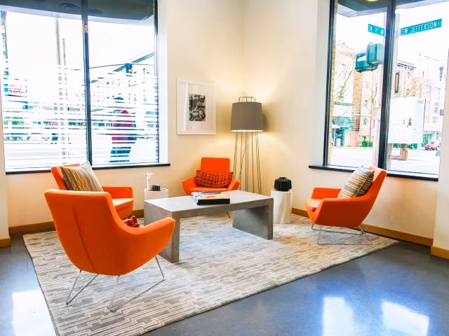 Clubhouse with contemporary design and modern seating at Museum Place Apartments, ideal for social gatherings and community events