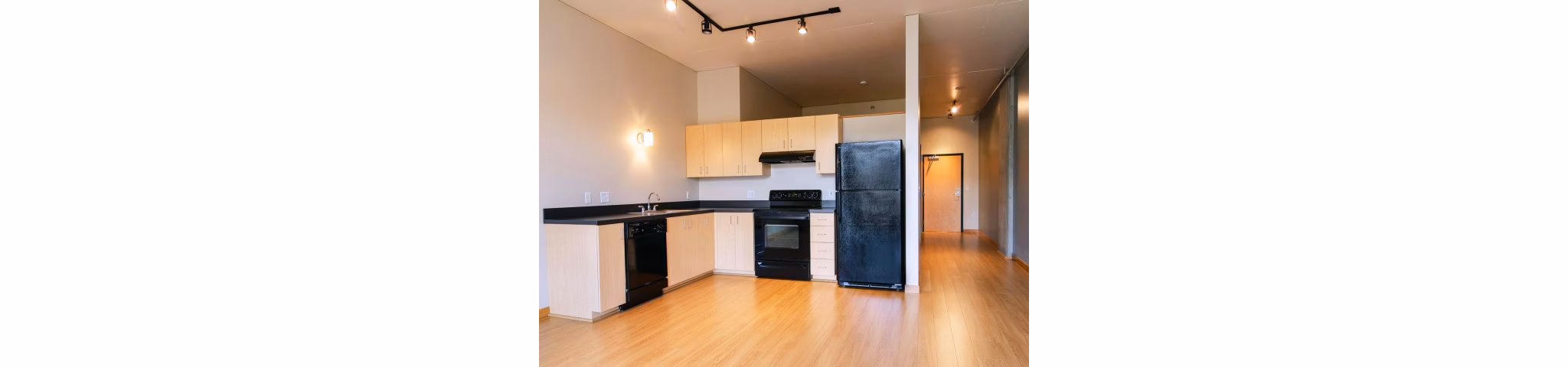 Modern kitchen with sleek cabinetry and stainless steel appliances at Museum Place Apartments