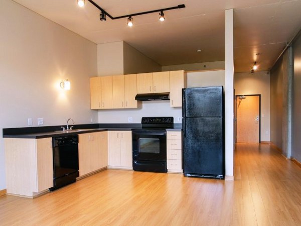 Modern kitchen with sleek cabinetry and stainless steel appliances at Museum Place Apartments