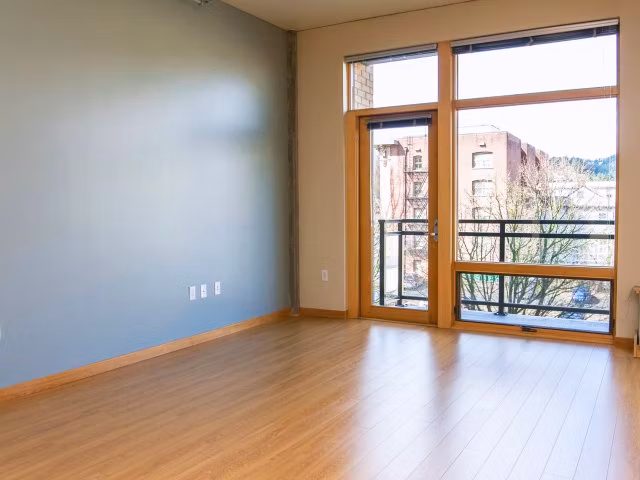 Spacious living room with modern decor in Museum Place Apartments