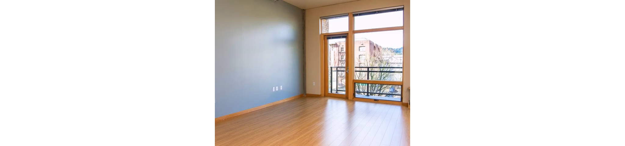 Spacious living room with modern decor in Museum Place Apartments