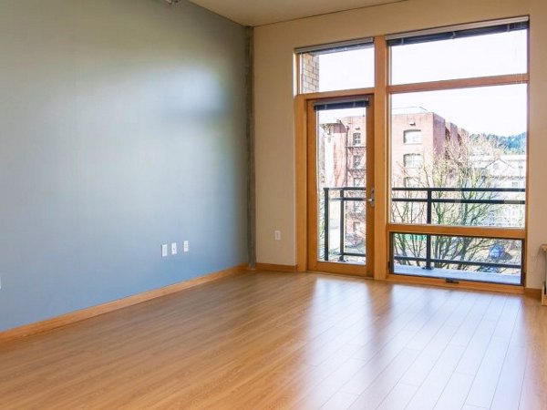Spacious living room with modern decor in Museum Place Apartments