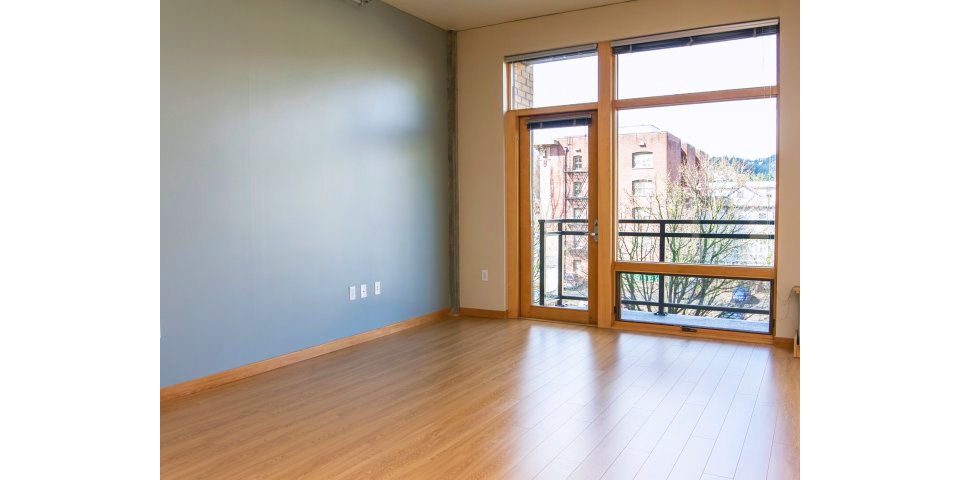 Spacious living room with modern decor in Museum Place Apartments