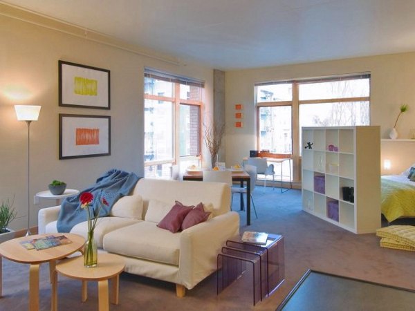 Spacious living room with modern decor at Museum Place Apartments, offering a luxurious living experience