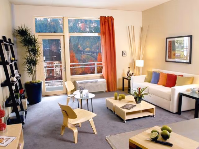 Modern living room with elegant decor at Museum Place Apartments, featuring spacious layout and natural light