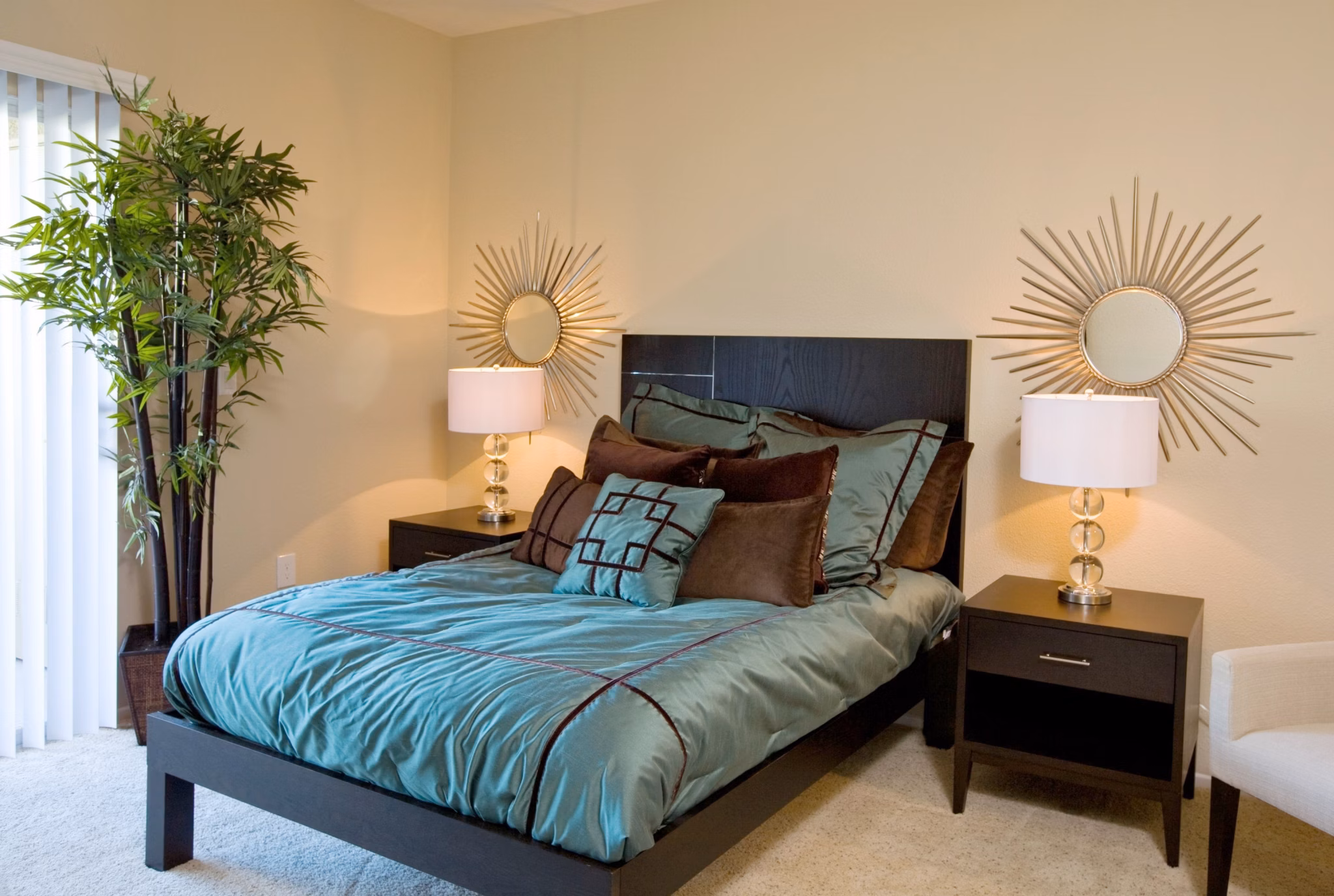 Bedroom featuring modern decor and ample natural light at Castlerock Apartments