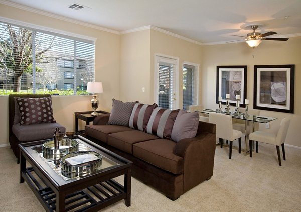 Spacious living room with modern decor and natural light in Castlerock Apartments, luxury living at its finest