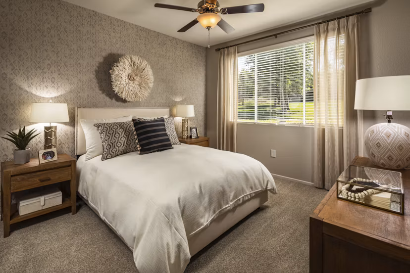 Bedroom with modern decor and soft lighting at Colonnade Apartments, a Greystar luxury property in a prime location