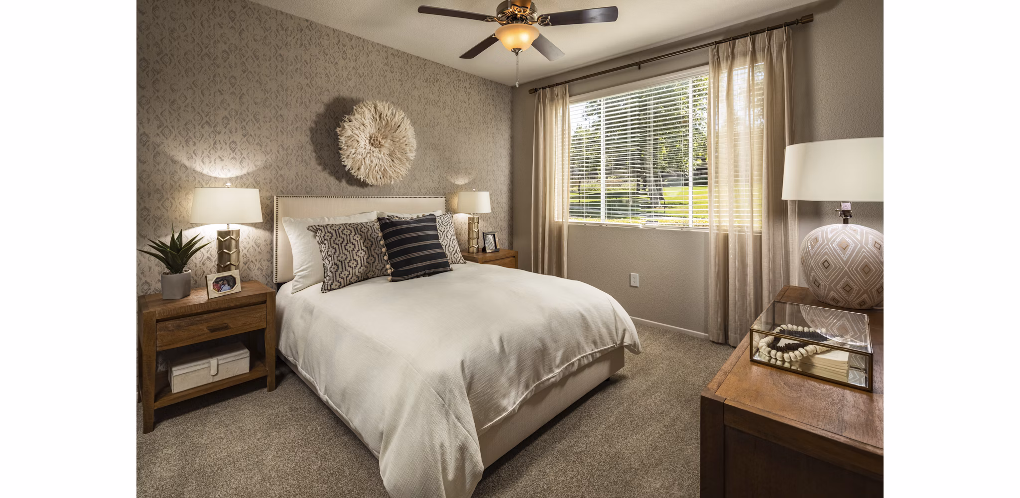 Bedroom with modern decor and soft lighting at Colonnade Apartments, a Greystar luxury property in a prime location