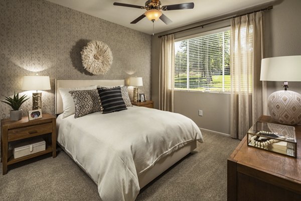 Bedroom with modern decor and soft lighting at Colonnade Apartments, a Greystar luxury property in a prime location