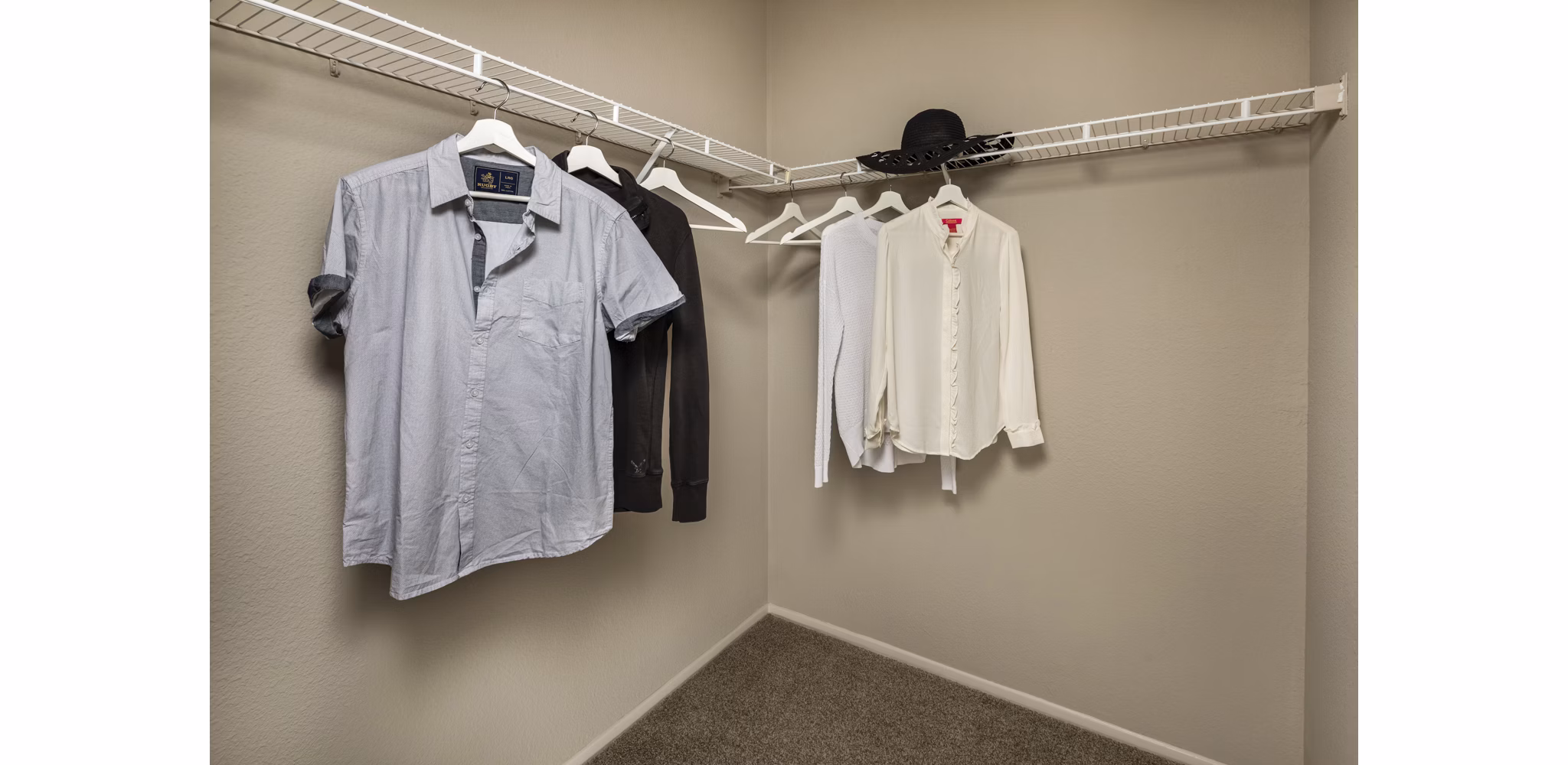 Walk-in closet with ample shelving in Colonnade Apartments, a Greystar luxury community